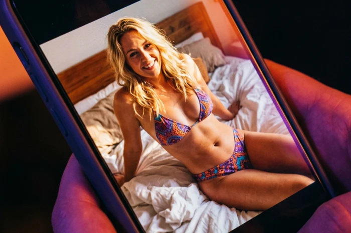 A sexy woman on a smartphone screen
